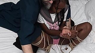 Tied up ebony schoolgirl moans through intense orgasm